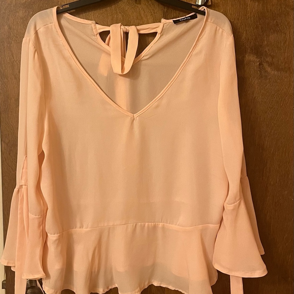 A peach RolyPoly sheer top